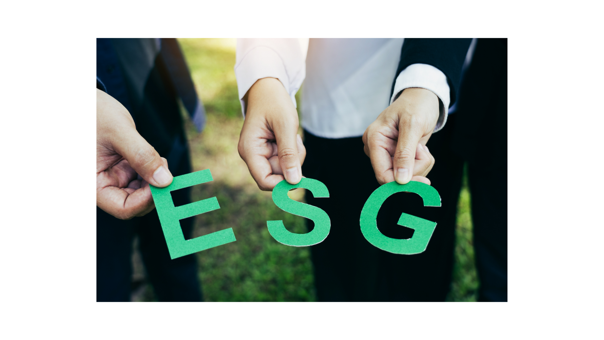 Hands holding letters spelling ESG